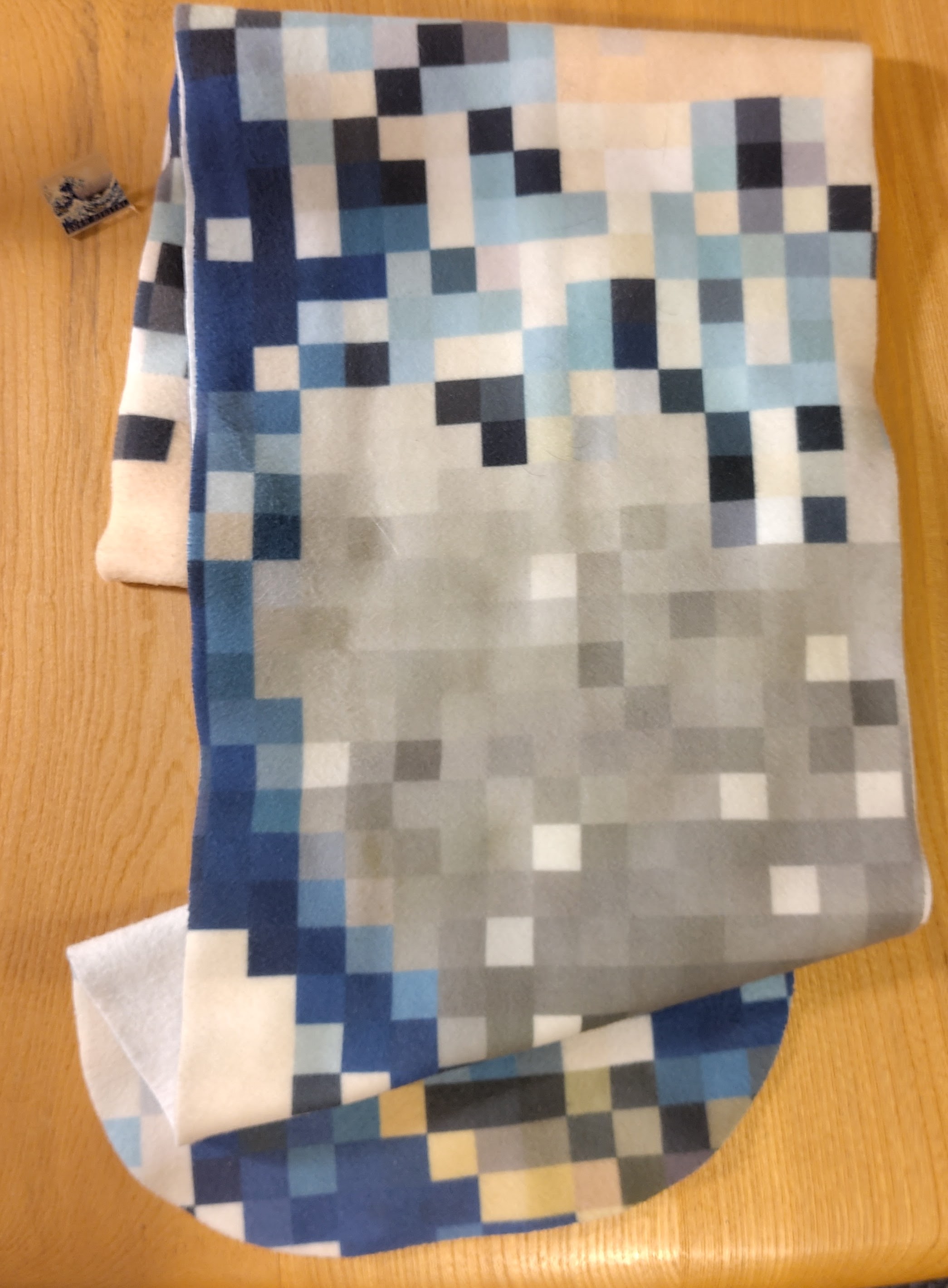 Fleece scarf with pixellated born digital wave pattern